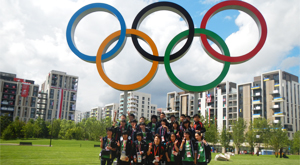 Under the Olympic symbol raised in the Olympic Village